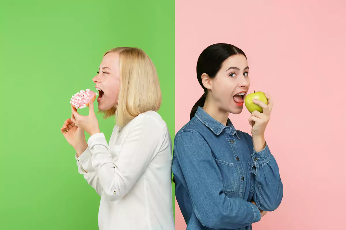 Young Women Choosing Fruits Cake